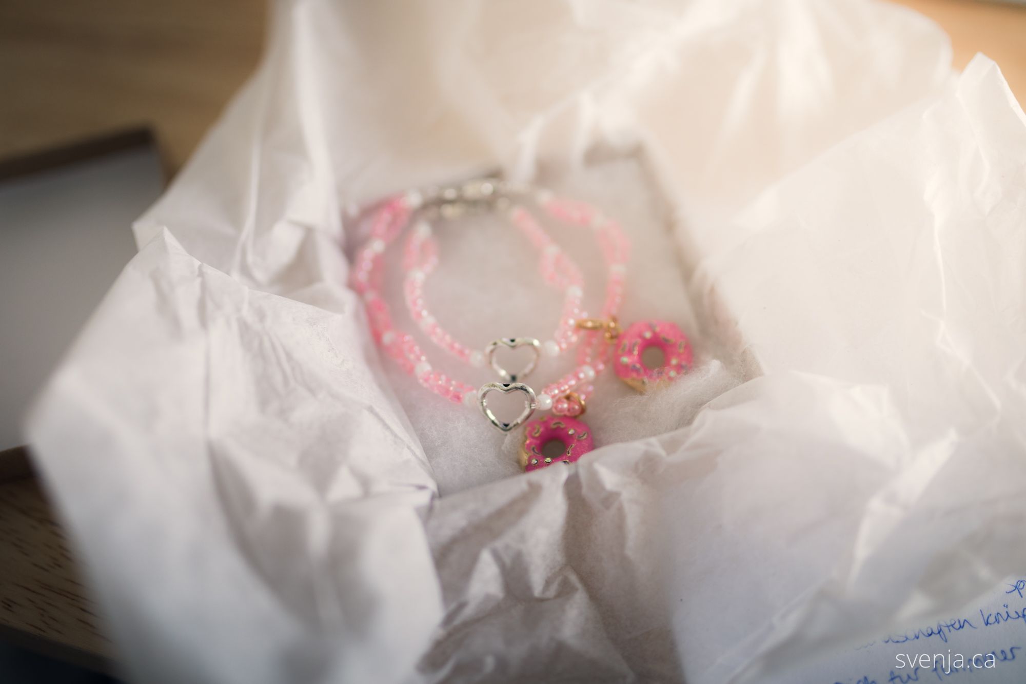 two bracelets lay in an opened box